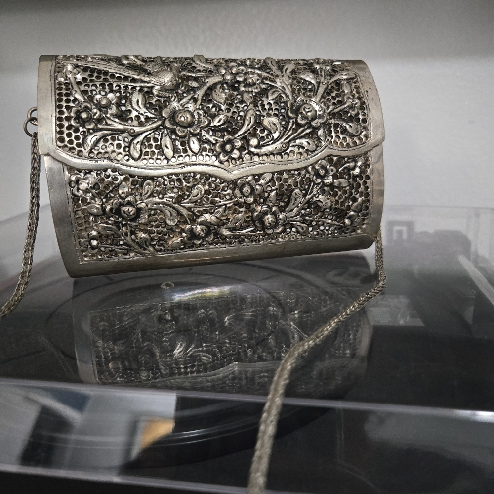 Metal clutch with shoulder strap